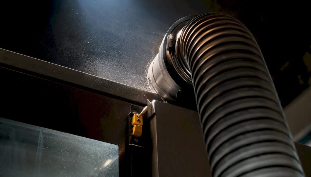 CNC dust extraction port capturing fine particles