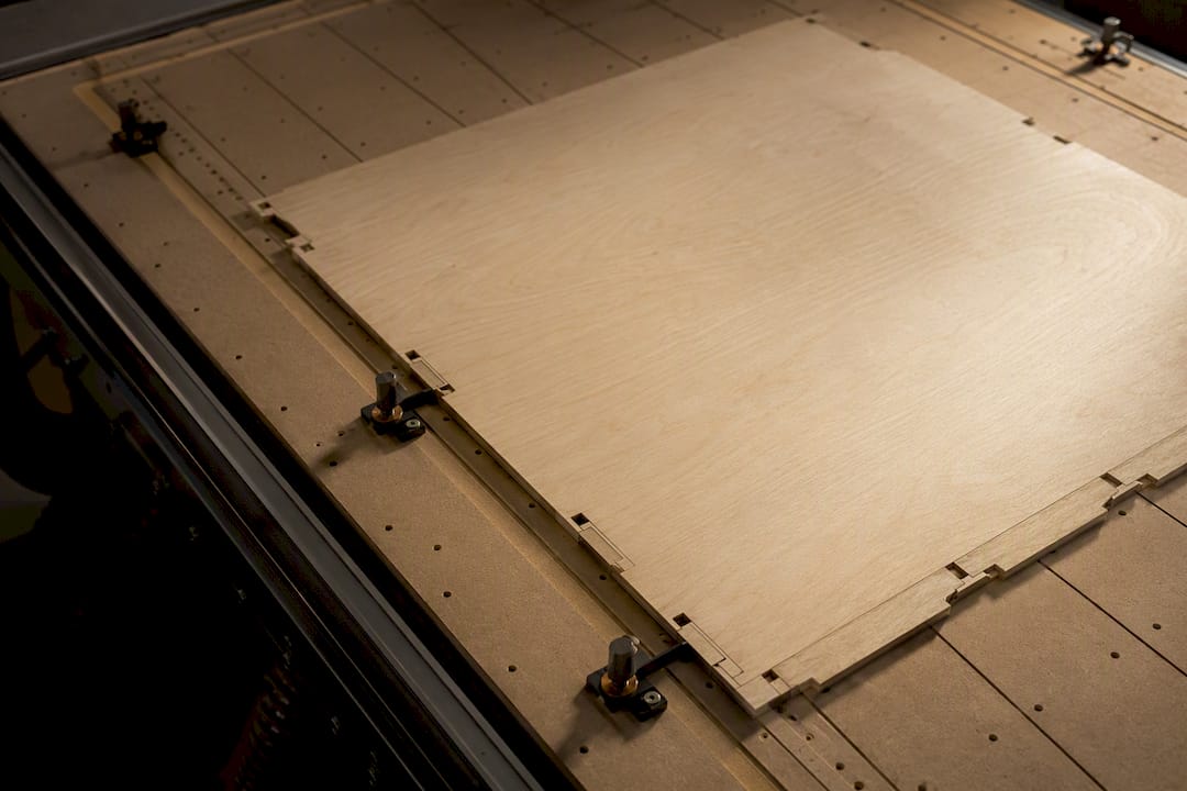 Timber panel secured on CNC spoilboard